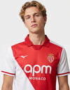 Maglia AS Monaco Home 2026/2027 Mizuno rosso e bianca a diagonale con stemma coronato e sponsor apm Monaco