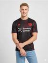 Bayer Leverkusen Maglia Home 2025/2026 New Balance - Vista Completa Nero e Rosso