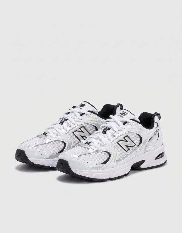 New Balance 530 bianche e nere con dettagli argento logo N nero e tecnologia ABZORB vista frontale