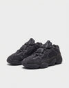 Coppia Adidas Yeezy 500 Utility Black vista tre quarti dettaglio suola adiPRENE