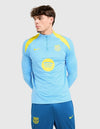 Primo piano frontale del top tuta Barcellona 2025/2026 azzurro con loghi gialli Nike e Spotify