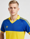 Dettaglio maglia Boca Juniors Home 1985/1986 Adidas con logo trefoil e colletto V giallo
